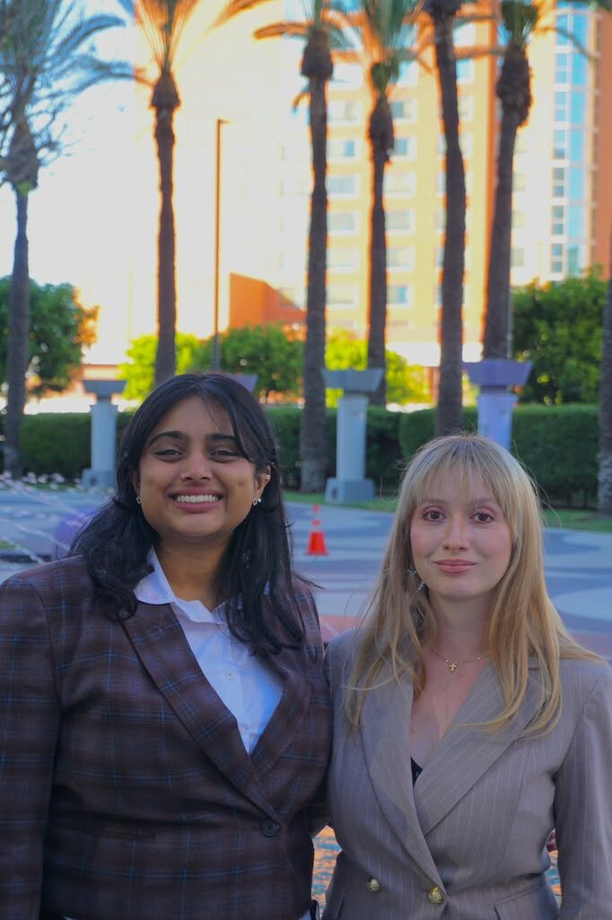 Two Diamond Cut Marketing team members smiling together