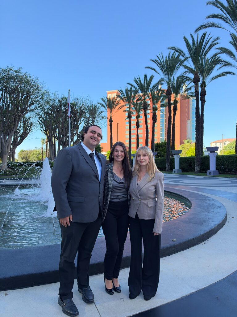 Three Diamond Cut Marketing team members by a fountain