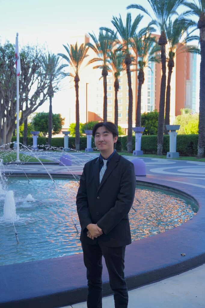 A Diamond Cut Marketing team member by a fountain